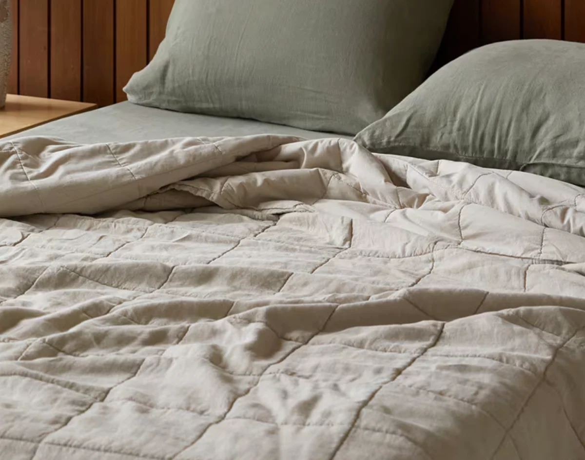 Quilts and comforters for layered bedding